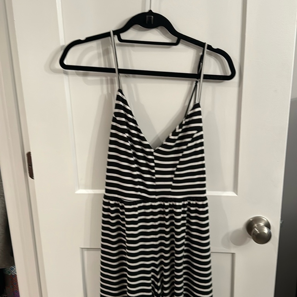 Black and white jumpsuit. NWT. Super soft. Adjustable straps.